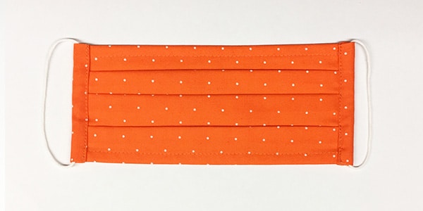 Faltenmaske: Orange weiße Punkte